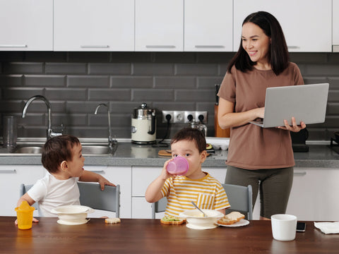 two children playing in the kitchen island