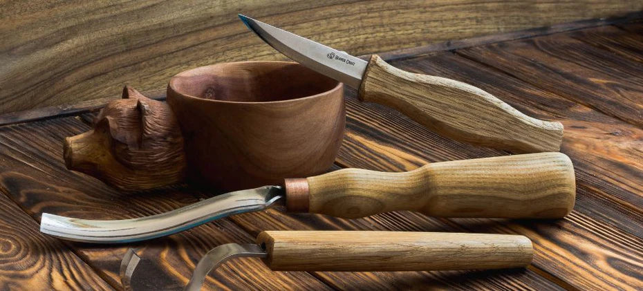 carved apple wooden bowl with carving tools