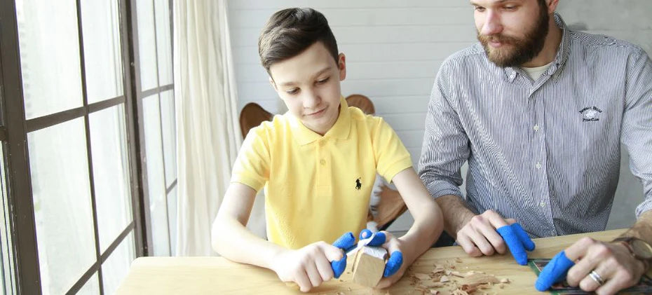 children carving wooden block