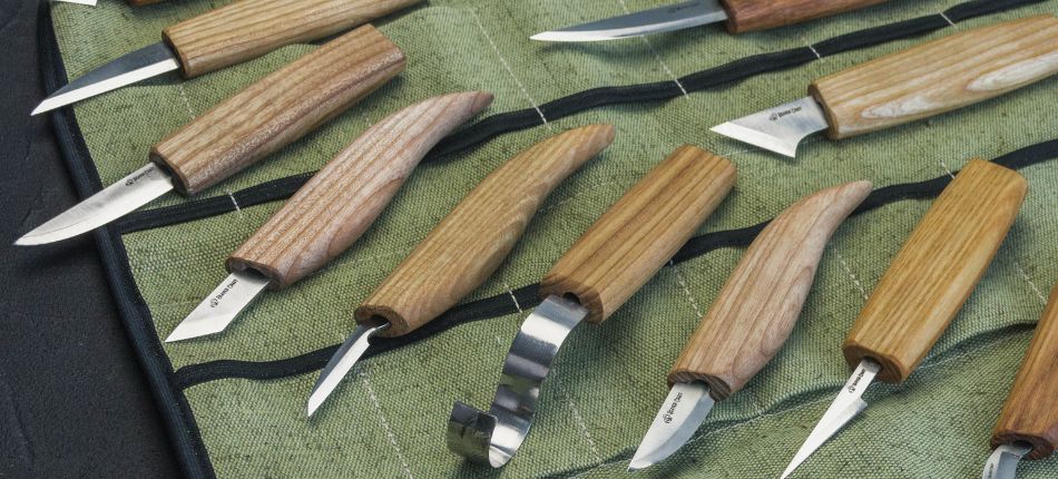 Knives on a green canvas