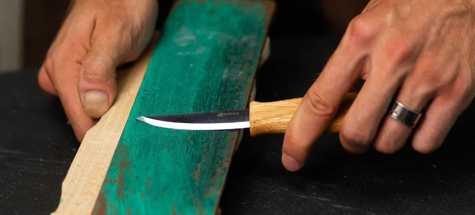 sharpening carving knife with a leather strop