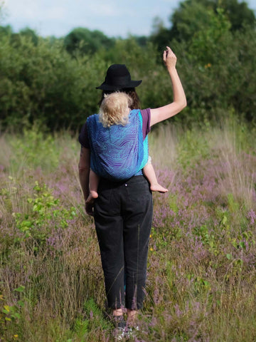 Back carrying in a woven wrap