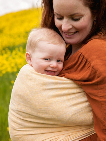 baby facing out in a ring sling