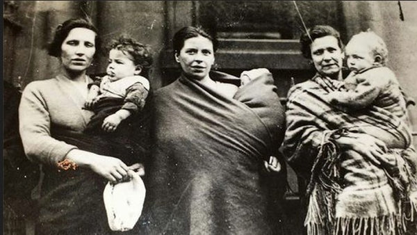 3 women standing together using the Plaid for their children