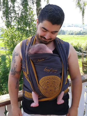 Baby carrying dad a using woven wrap