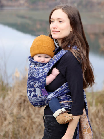 Mum and baby wearing baby carrier for newborns