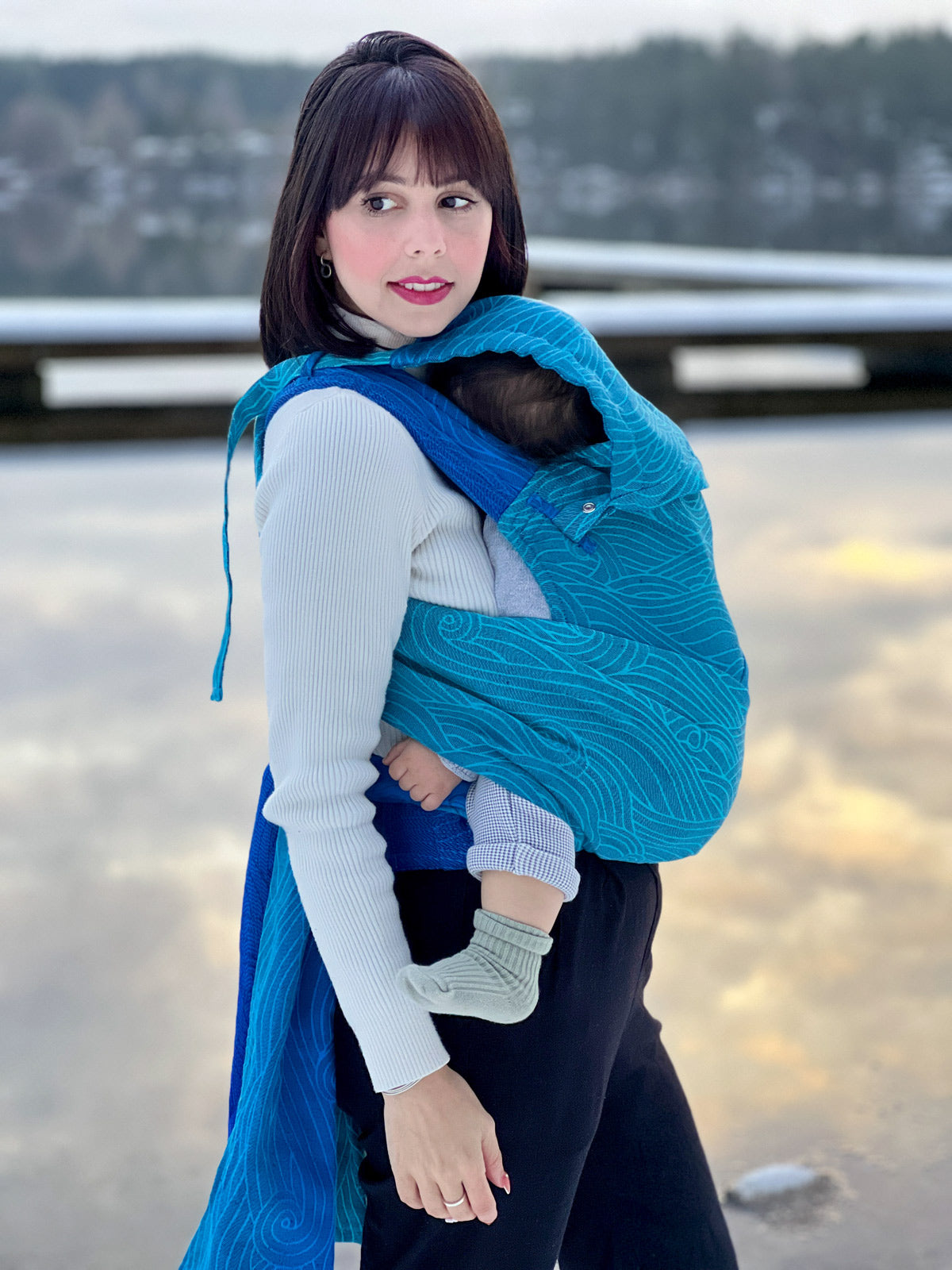 blue toddler carrier in a front carry