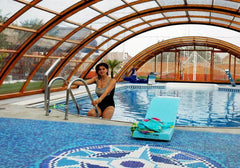 Swimming inside a Universe retractable pool enclosure