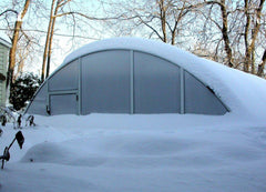 outdoor pool enclosure covered with snow