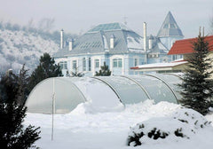Universe Pool Enclosure from a distance with snow on enclosure