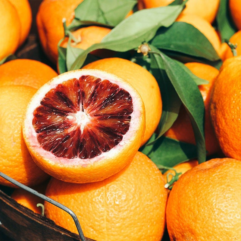 Bright, vibrant blood oranges Fresh cut dark red Blood Oranges Halved blood oranges