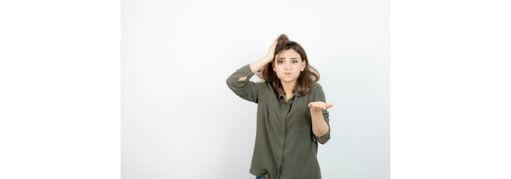 a young girl worried about her oily scalp