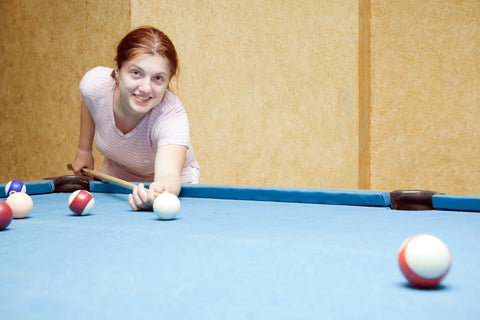 girl playing pool