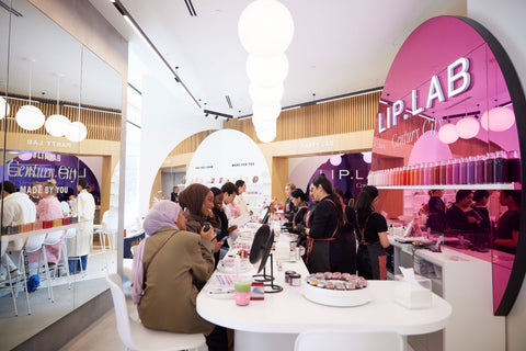 A group of people in a Lip Lab store enjoying an appointment