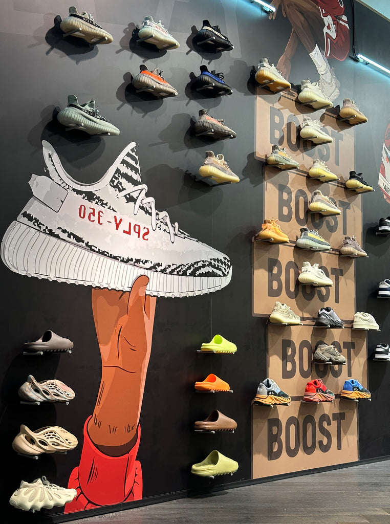 Yeezy wall at ALEXANDRE, a wall with a cool Yeezy print and a bizarre variety of Yeezy sneakers