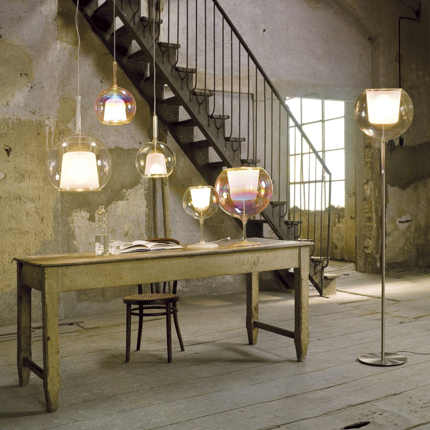 Rustic, under-construction room with set-up of ‘Glo Lamp’ by Penta. Featuring glass sphere designer floor lamp Singapore.