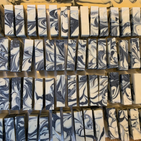 overhead view of bars of soap with black swirls