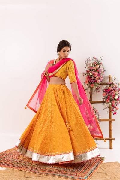 Rani & White lehenga choli with Bandhni dupatta- TRILOGNA