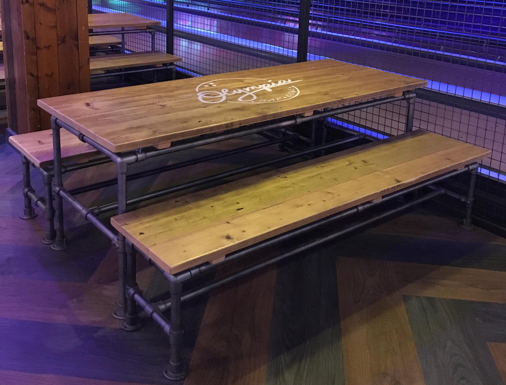 image showing table and benches bade from key clamps with a bowling alley background