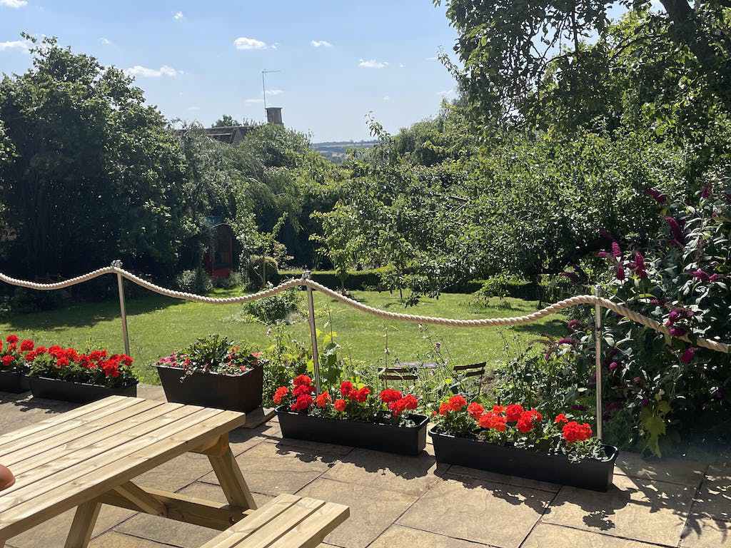 view of garden with key clamps in background used for handrail with rope