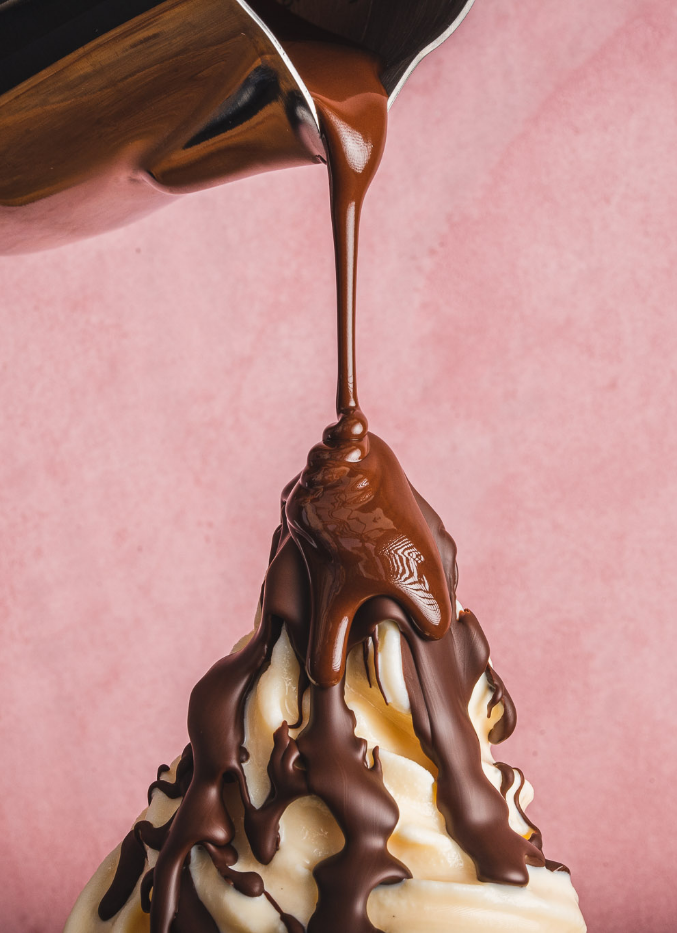 chocolate dripping on top of vanilla ice cream