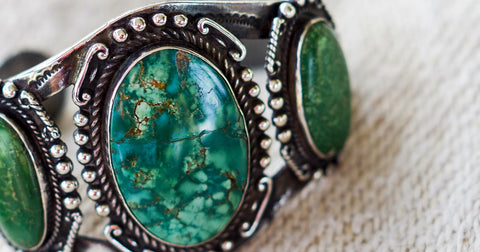 fake turquoise jewelry bracelet has cracked stones in the middle
