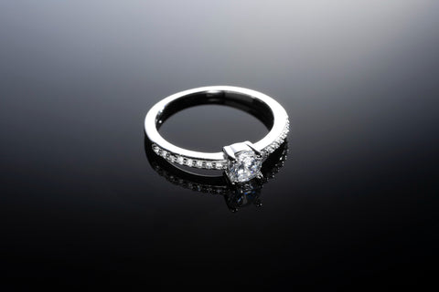 A sleek silver ring adorned with a captivating, minimalist design