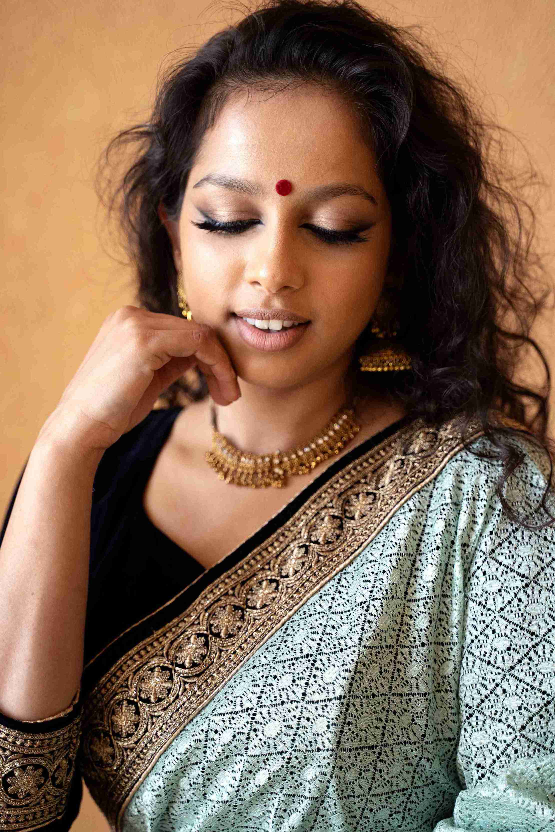 young-indian-woman-wearing-sari (1)_11zon.jpg__PID:a6923188-550b-4c5d-aaad-593f4f335cfb