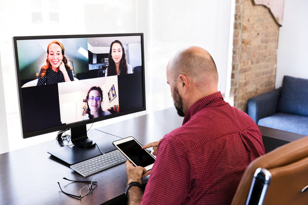 Three people connecting via Microsoft Teams