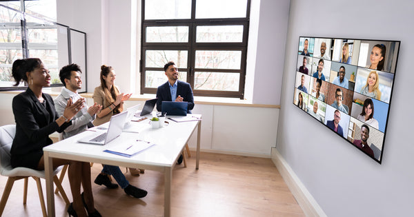 A group of employees holding a zoom room conference