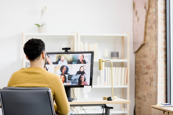 A worker having an online meeting via Google Meet