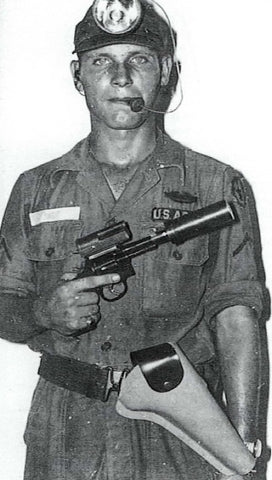 An American tunnel rat soldier with his special suppressed revolver and weapon light combo