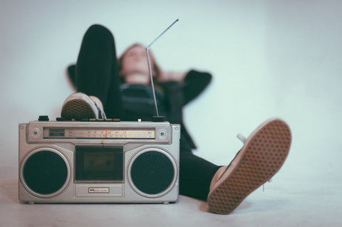 Guy listening to music on a boom box