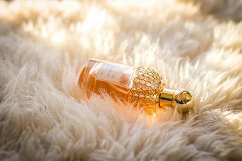 A bottle of oil perfume on the mat