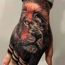 Lion on hand tattoo