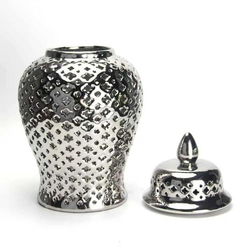 Pierced ceramic vase with lid