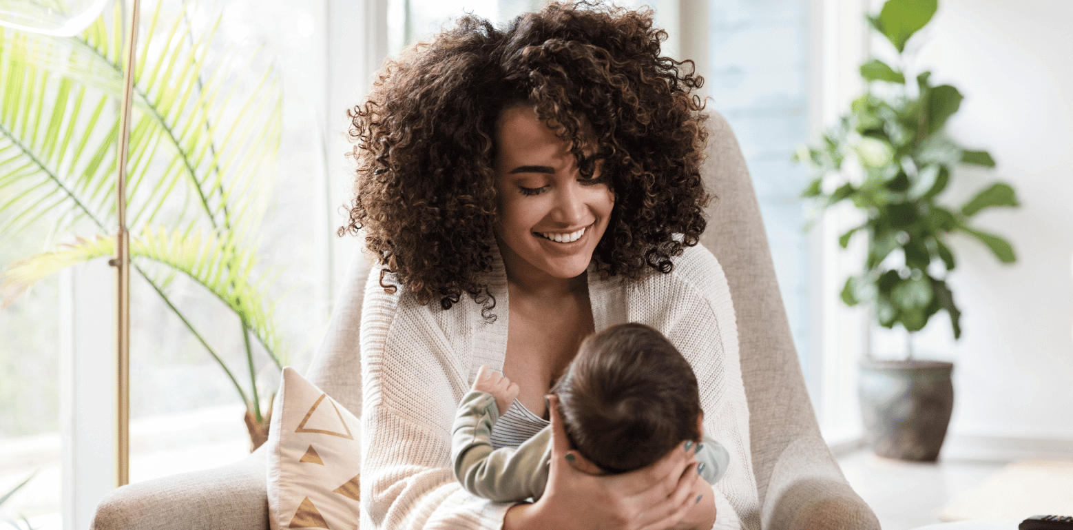 Nannycare formula fed baby starting back up at smiling mother