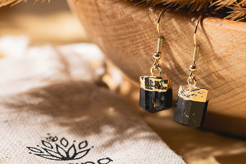 A pair of black tourmaline earrings with gold-plated settings