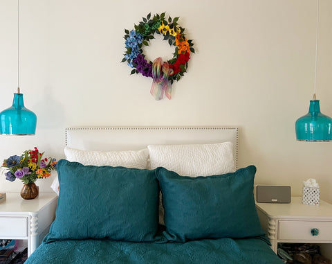 Pride wreath over bedroom headboard