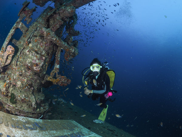 Scuba diver exploring the Htms Sattakut Wreck