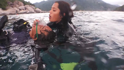 Diver rescue in open water, providing emergency oxygen, at Koh Tao, Thailand