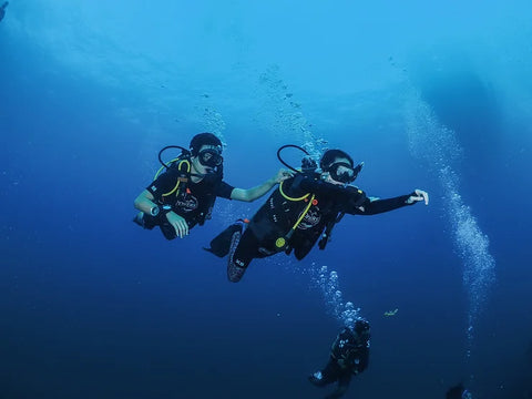 Divers practicing navigation during the Underwater Navigation Adventure Dive