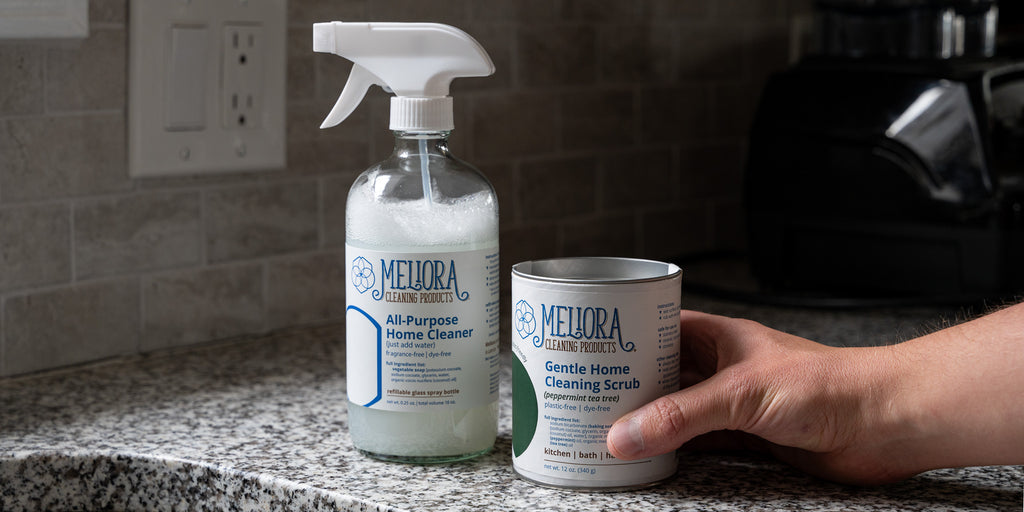 A side-by-side image of Meliora all-purpose cleaner and Meliora cleaning scrub