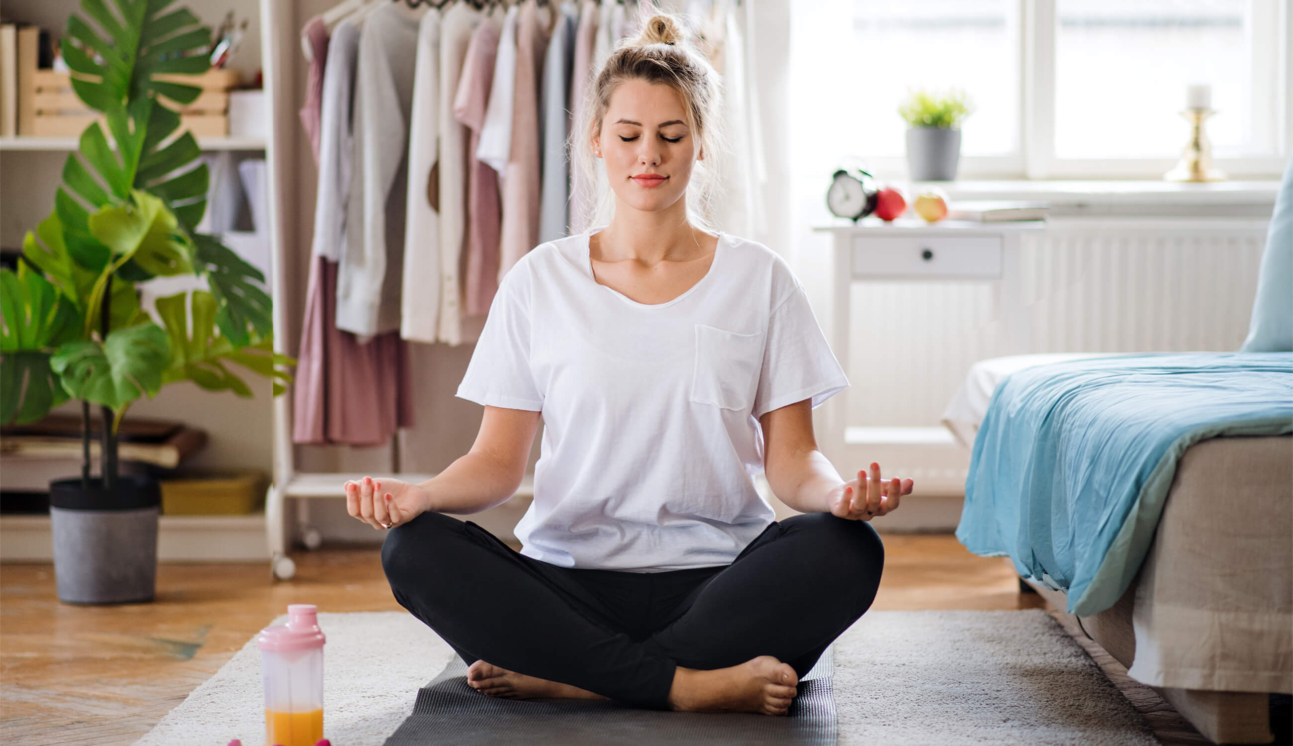 main_young woman doing yoga