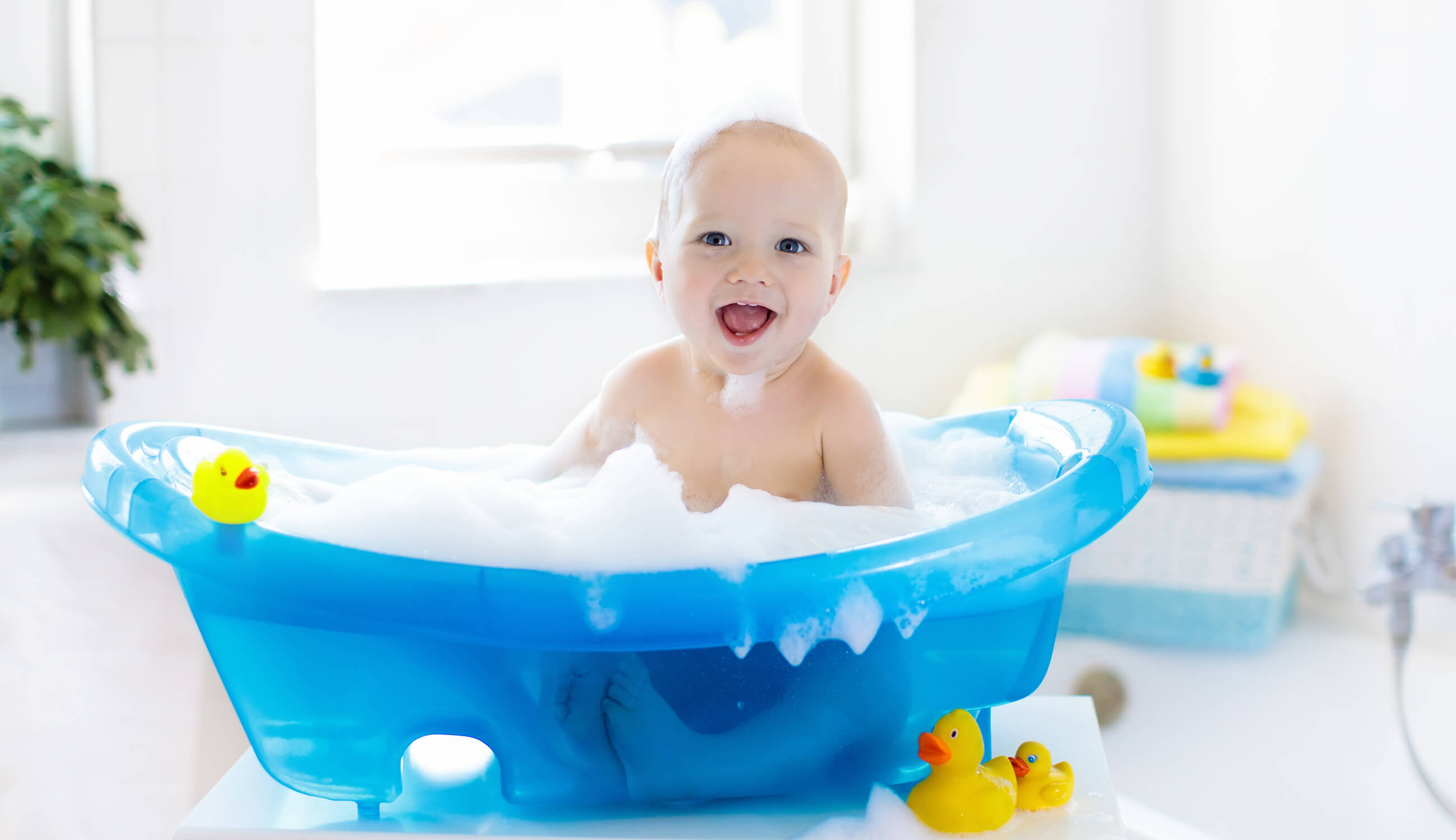 happy baby in bath