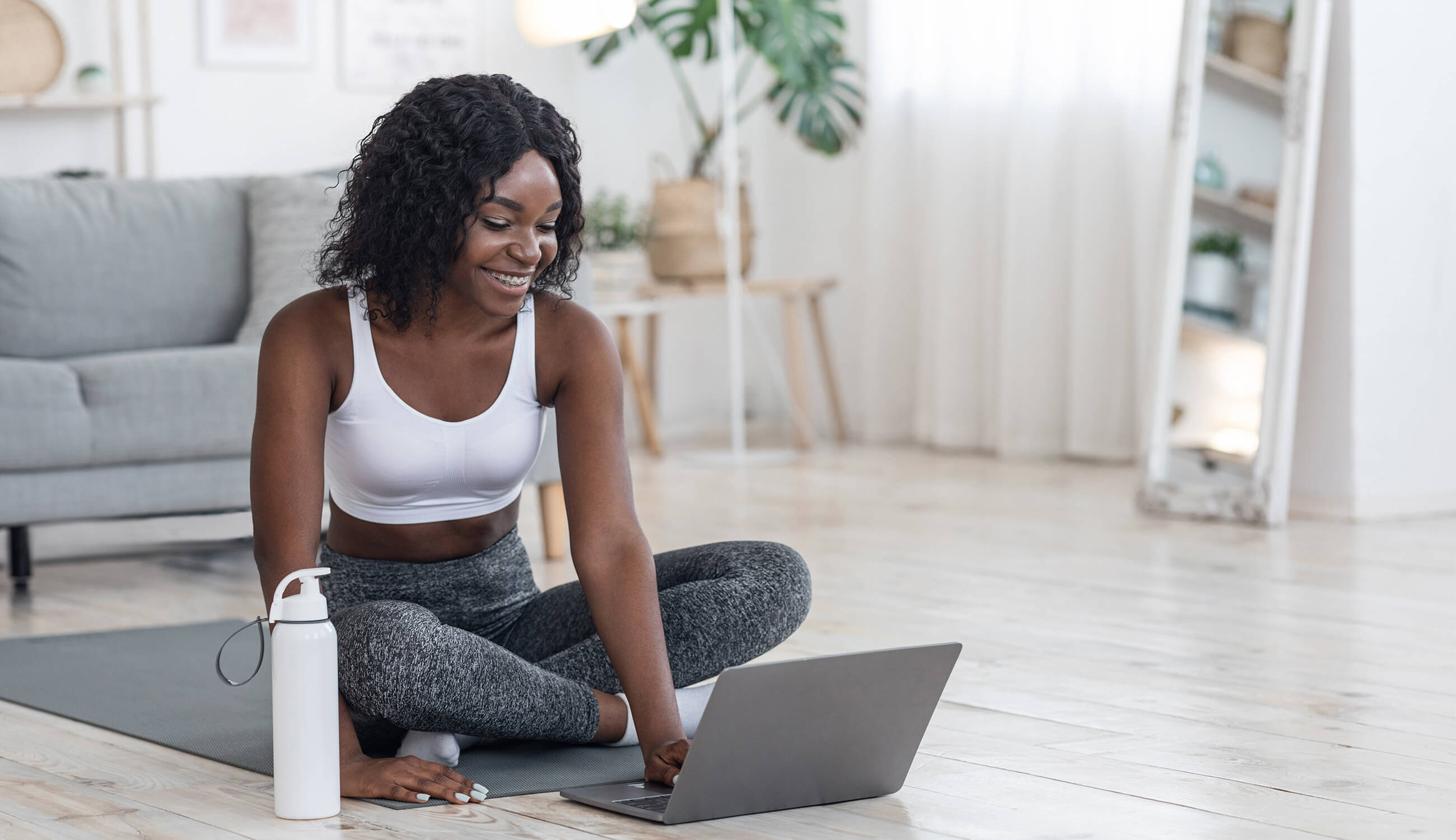 https://cdn.shopify.com/s/files/1/0648/1955/files/main_Woman_using_laptop_on_yoga_mat.jpg?v=1603206740