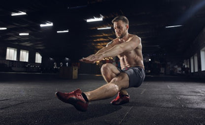 A man doing a single-leg squat while working out and exercising