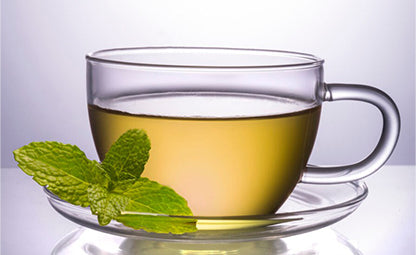 Cup of green tea with mint