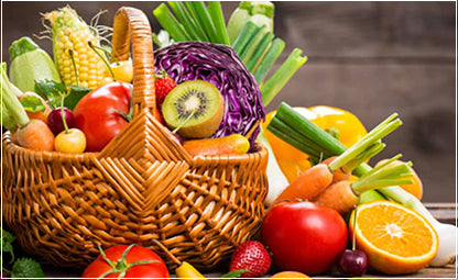Wooden basket filled with fresh and healthy fruits and vegetables