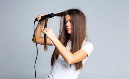 A woman using hair straightener